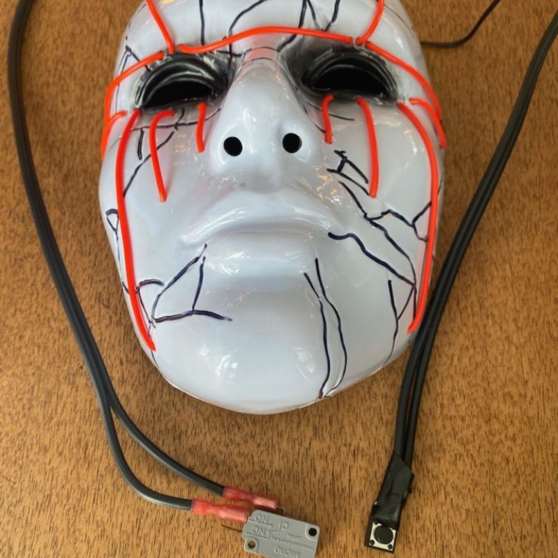 The Jester mask and buttons Each button activated the mask's lights and triggered different sound effects.